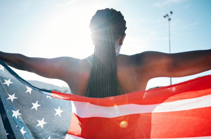 Person holding USA flag