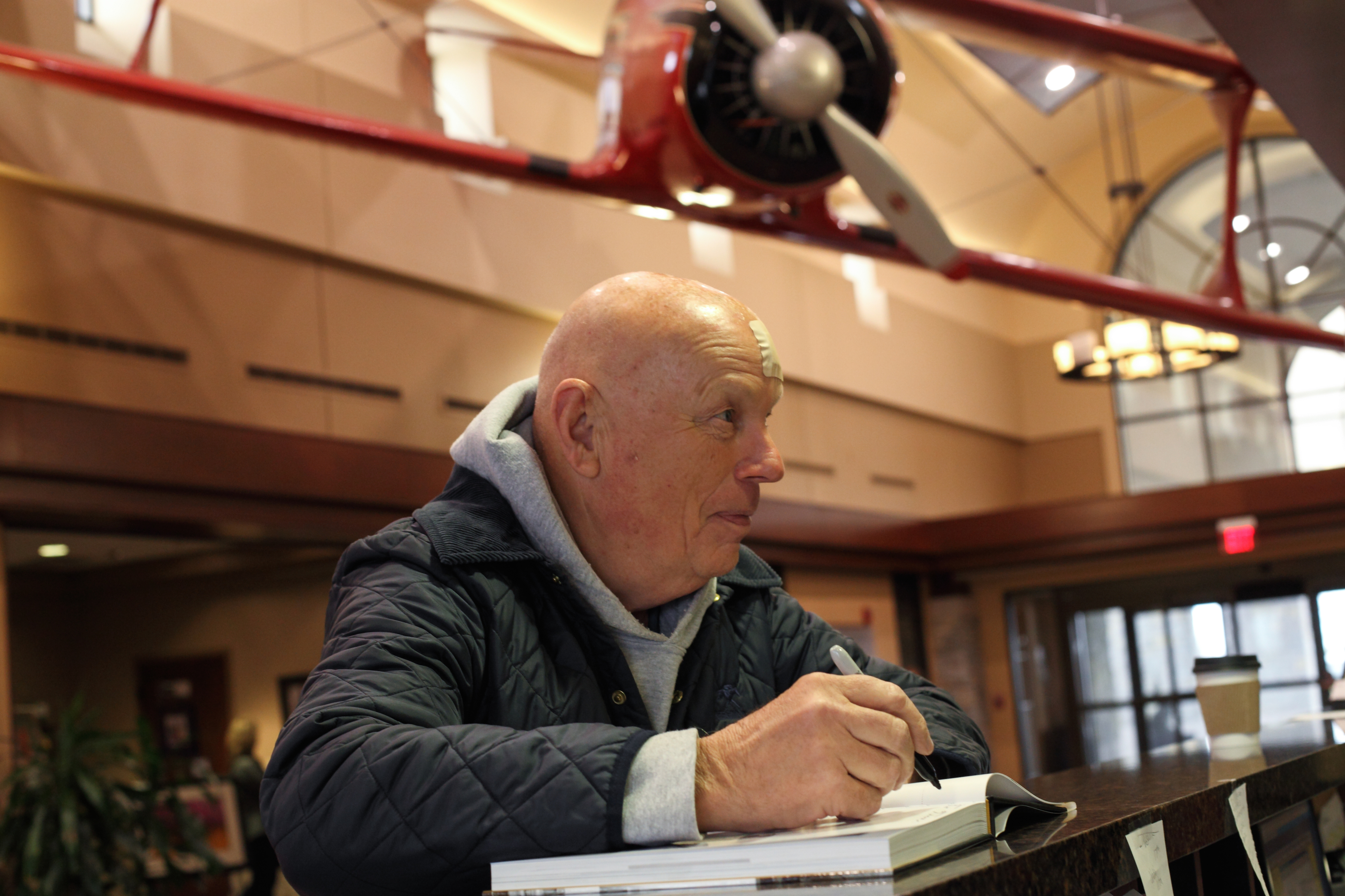 UK alum and former astronaut returned to Lexington to help promote a book about Blue Grass Airport in Lexington. Here he is signing the book.