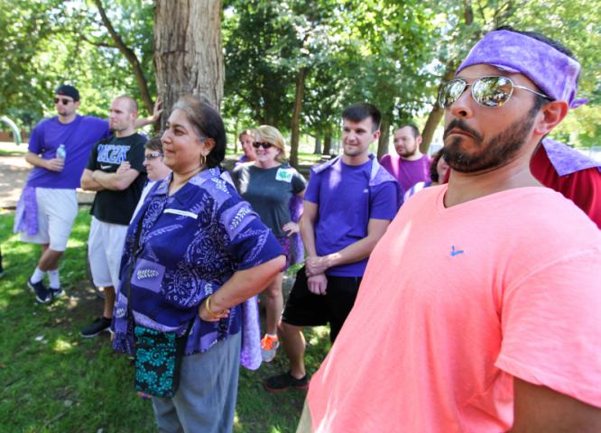 The purple team looks on